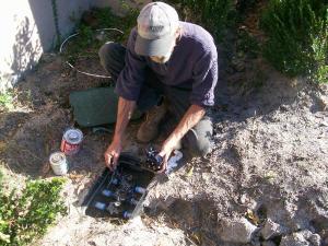 Irrigation repair technician in Citrus heights checks a valve box